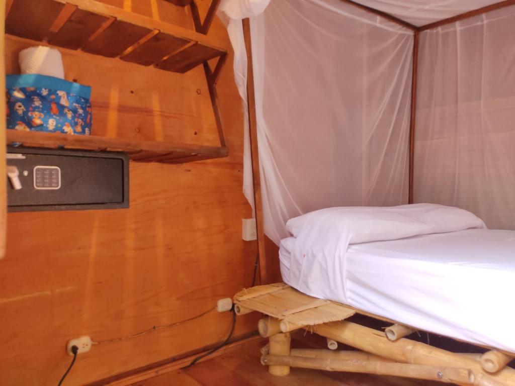 Postel nebo postele na pokoji v ubytování Posada Corazon Mazunte - Natural Vibe Satori