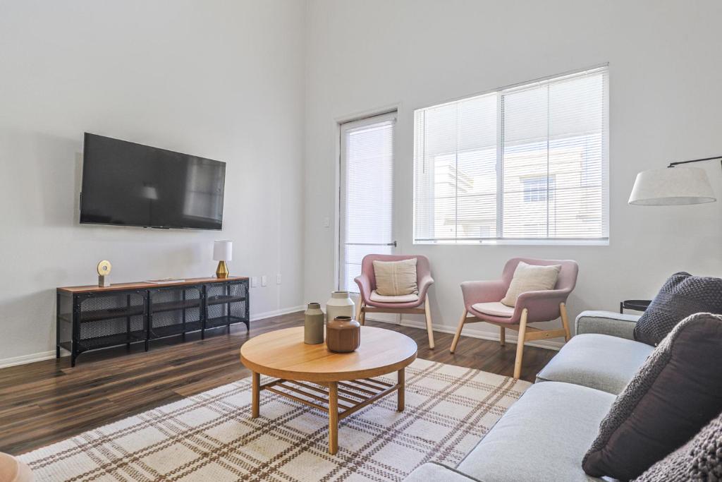 a living room with a couch and chairs and a tv at Housy & Comfy 4BDR & 2BTH in Marina del Rey for 10 pax in Los Angeles