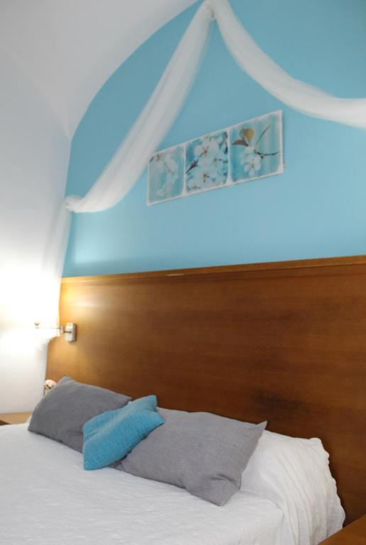 Postel nebo postele na pokoji v ubytování Hostal Imperial