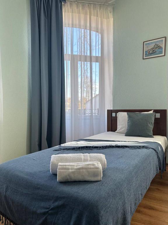 Postel nebo postele na pokoji v ubytování Apartamenti DVINSKA