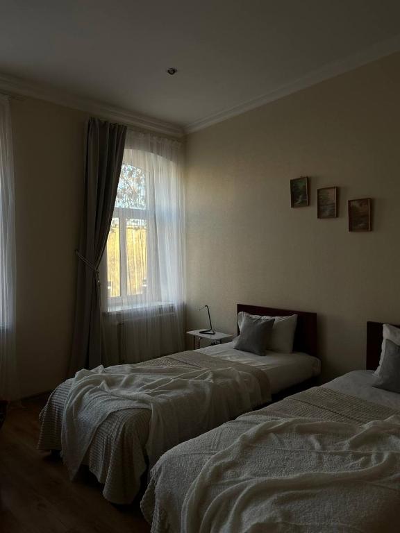 Postel nebo postele na pokoji v ubytování Apartamenti DVINSKA