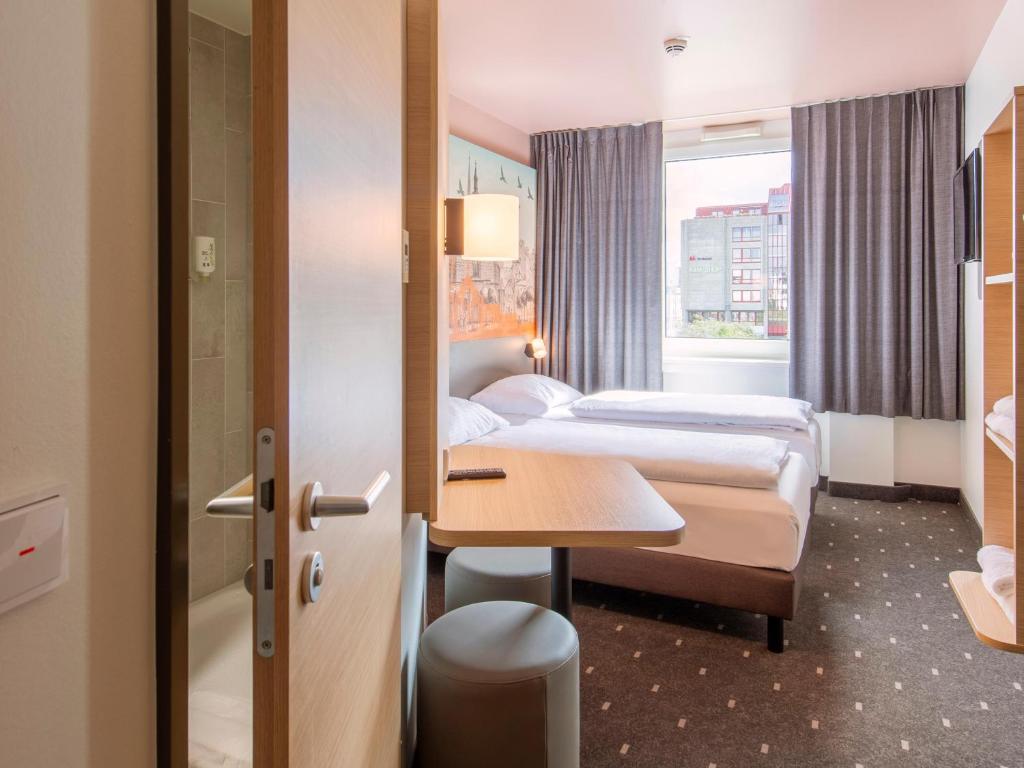 Postel nebo postele na pokoji v ubytování B&B Hotel Nürnberg-Hbf