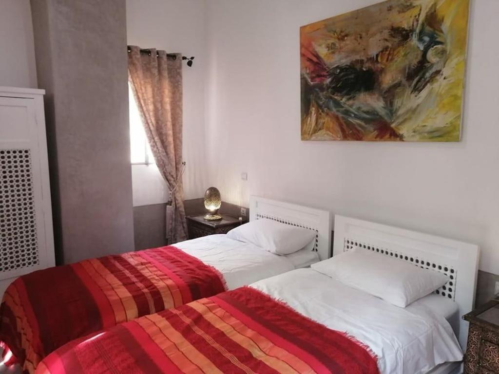 Postel nebo postele na pokoji v ubytování Dar 14 Marrakech