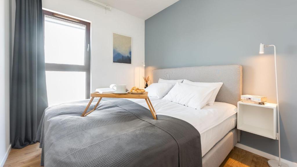 Posteľ alebo postele v izbe v ubytovaní Flatbook - City Center SPA Apartments Toruńska 11