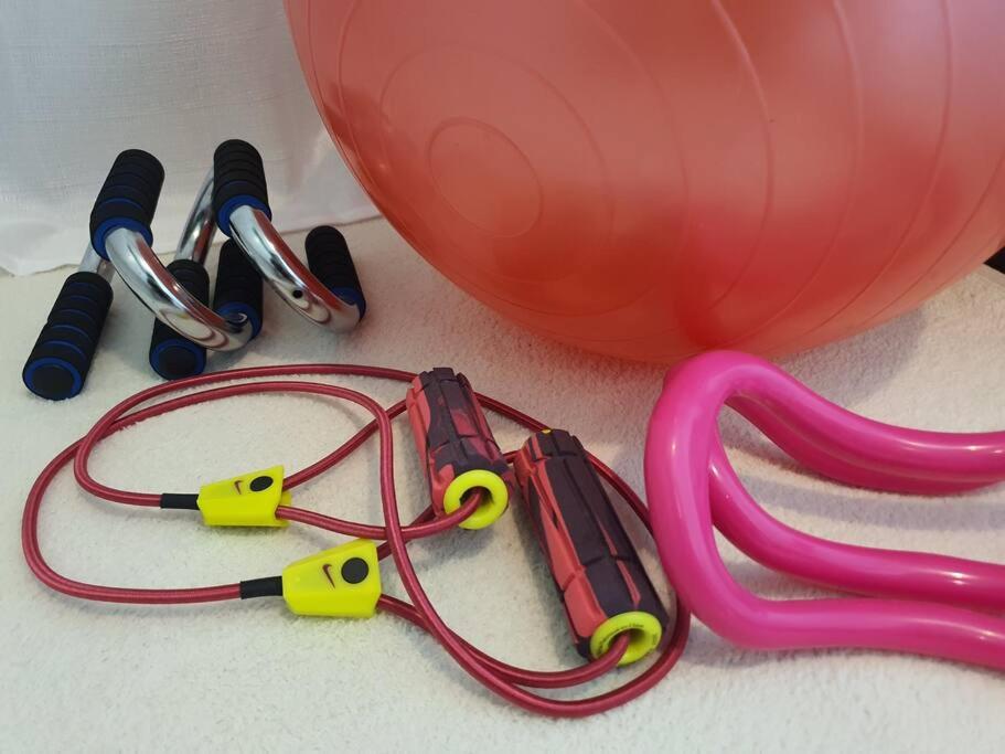 a pair of headphones and a pink balloon with a leash at 숙소 운영 휴무중 in Cheonan
