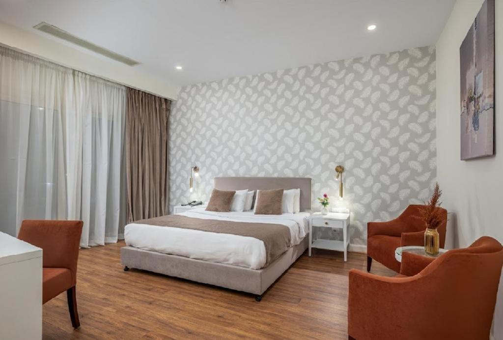Postel nebo postele na pokoji v ubytování Tolip Family Park Hotel