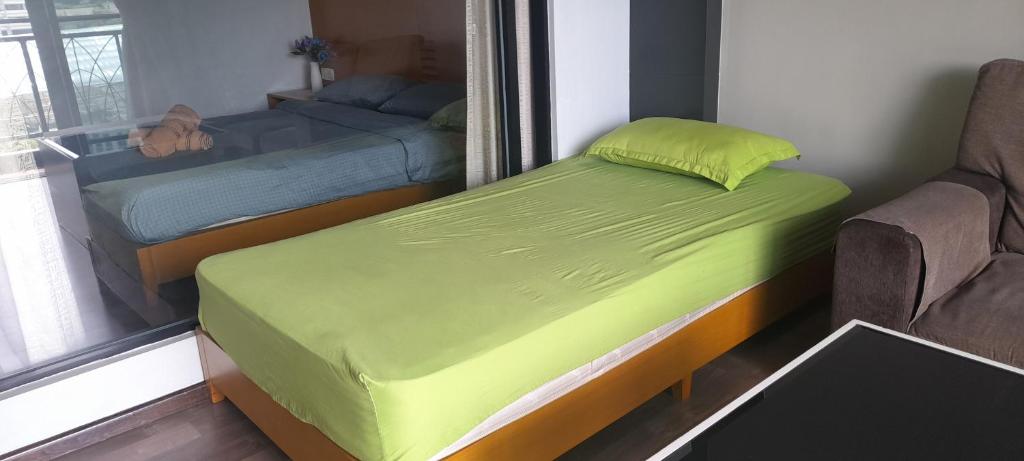Postel nebo postele na pokoji v ubytování Cameron Square
