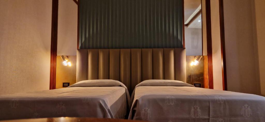 Postel nebo postele na pokoji v ubytování Grand Hotel Duca D'Este