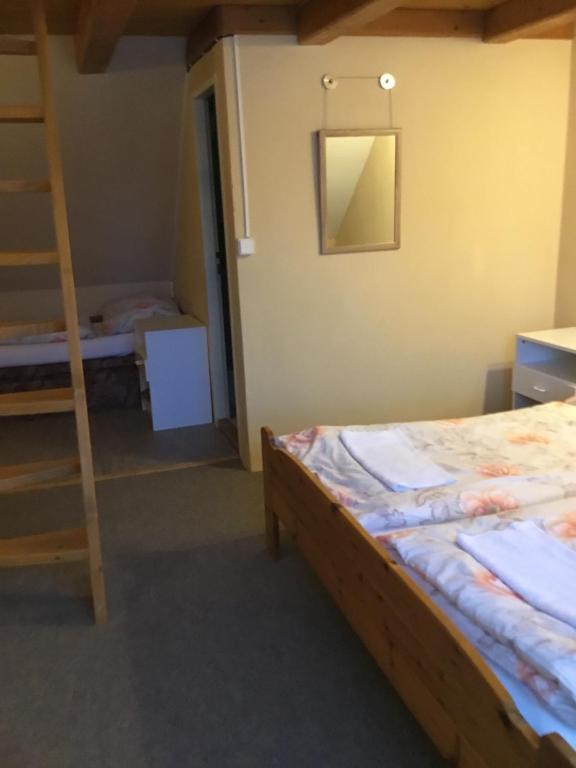 Postel nebo postele na pokoji v ubytování Penzion Real