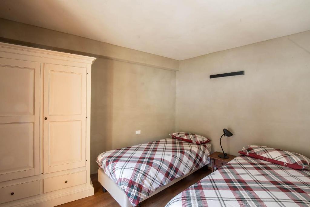 Postel nebo postele na pokoji v ubytování La Noix - Alloggi ad uso turistico - VDA - ARVIER - n 0041 e n 0042