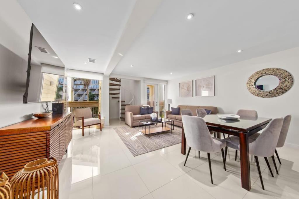 a living room with a table and a dining room at Amazing BahiaMar beachfront 2 steps from amenities in South Padre Island