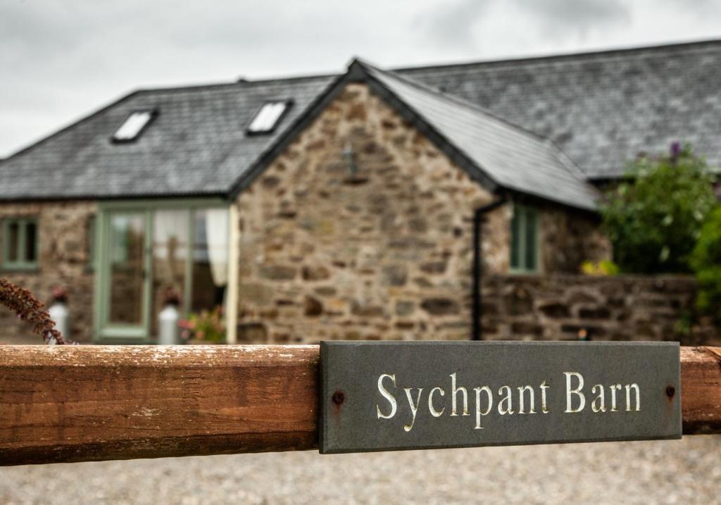 a sign that reads synonym barn in front of a house at Sychpant Barn in Velindre