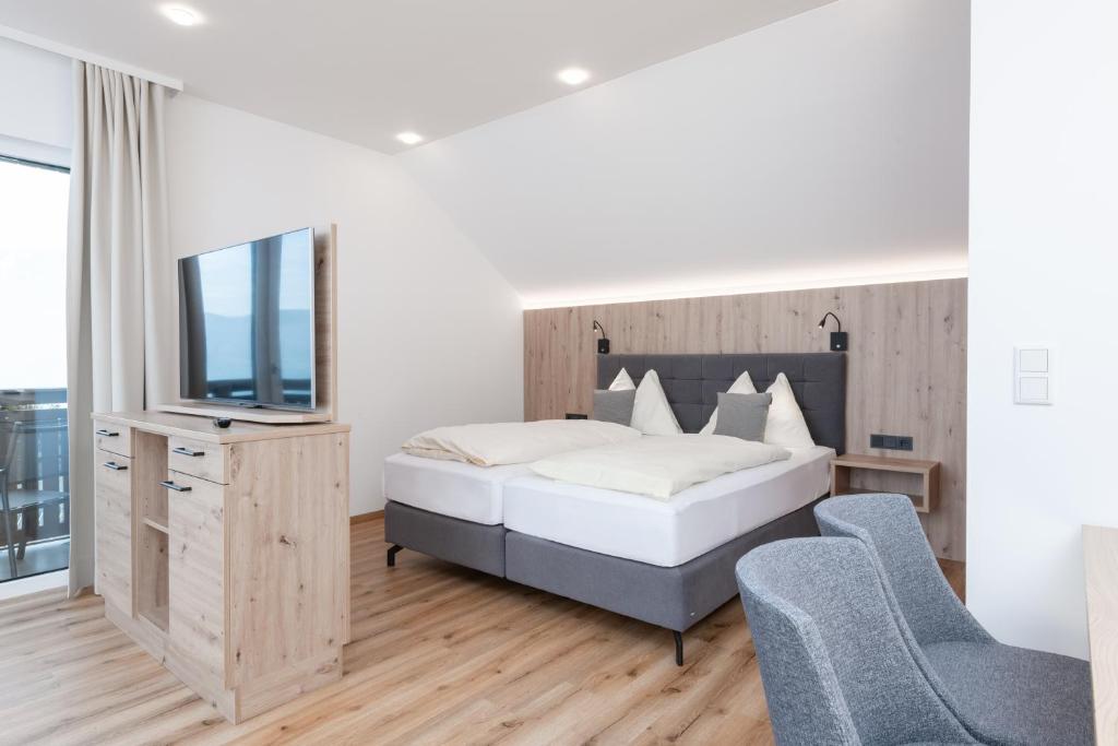 Postel nebo postele na pokoji v ubytování Hotel Schönberger