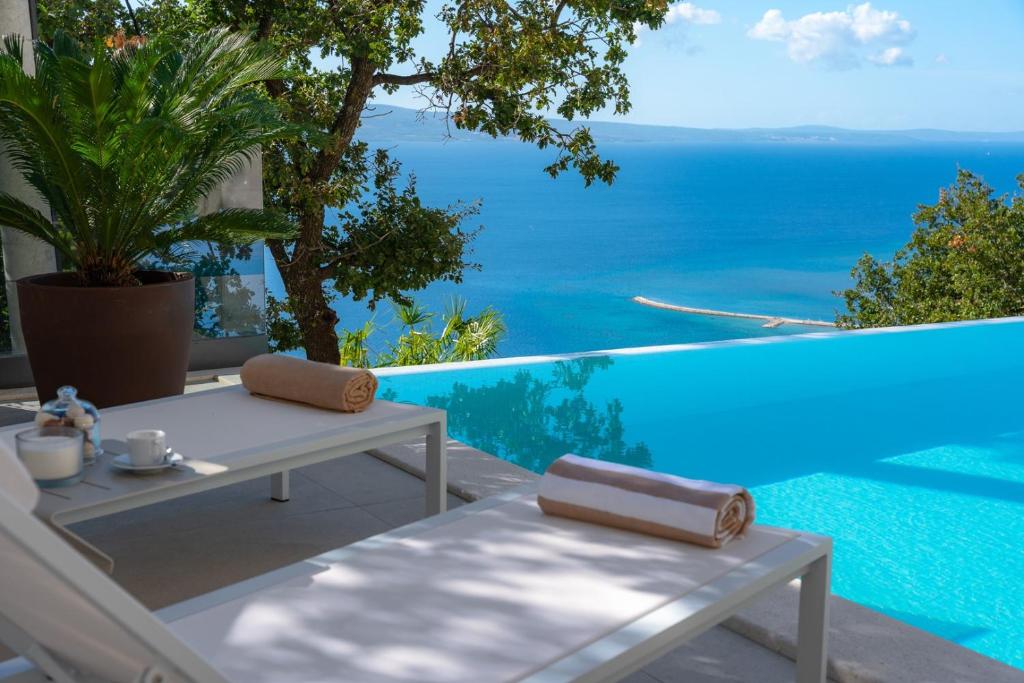 a patio with a view of the ocean at Luxury Villa La Mirada in Omiš