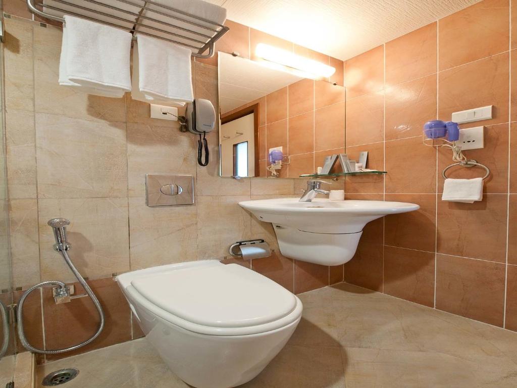 Koupelna v ubytování Grand Residency Hotel & Serviced Apartments