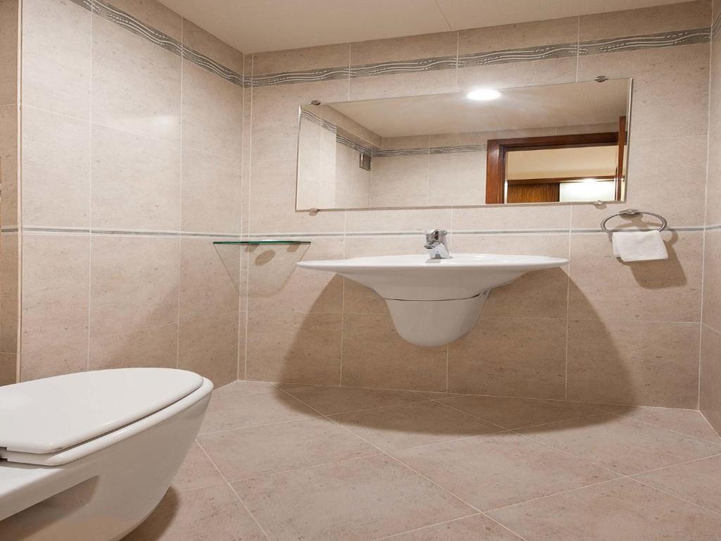 Koupelna v ubytování Grand Residency Hotel & Serviced Apartments