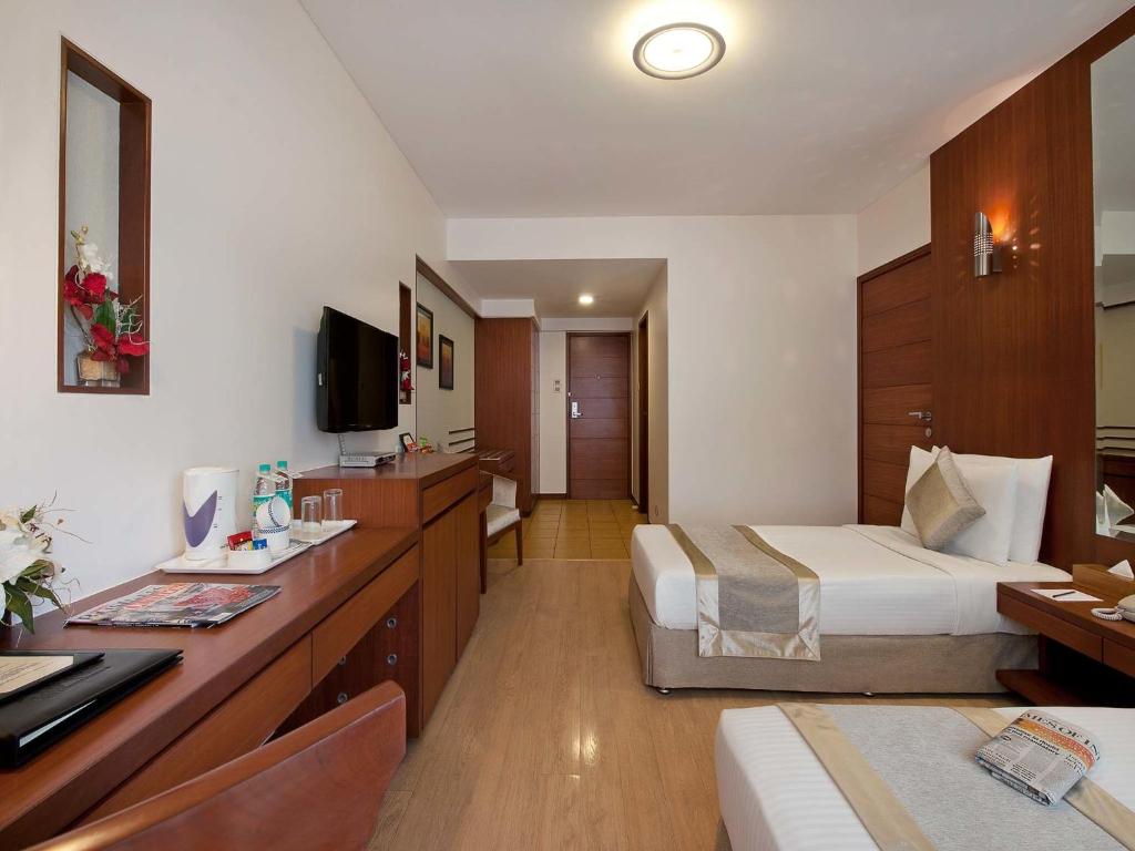 TV a/nebo společenská místnost v ubytování Grand Residency Hotel & Serviced Apartments