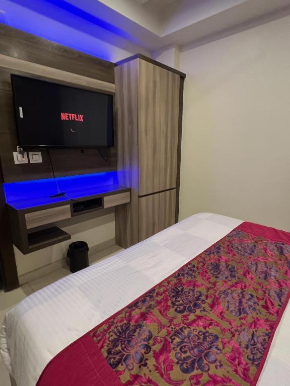 Postel nebo postele na pokoji v ubytování Hotel Apple Inn & Suites, New Delhi