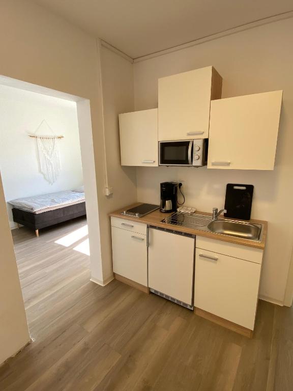 Kuchyň nebo kuchyňský kout v ubytování Apartmenthaus Selbitz