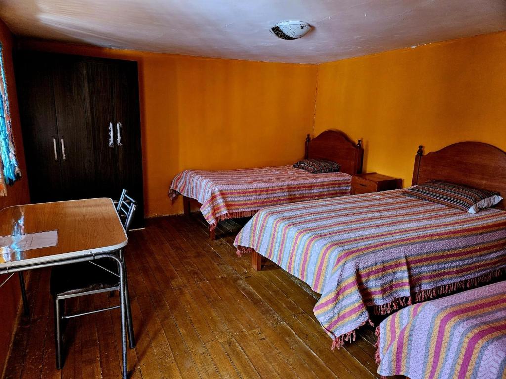 Postel nebo postele na pokoji v ubytování KanchayKillaWasi