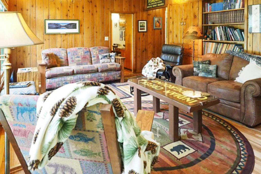 a living room with a couch and a table at 60073 Wallowa Lake Hwy (upper unit) in Joseph