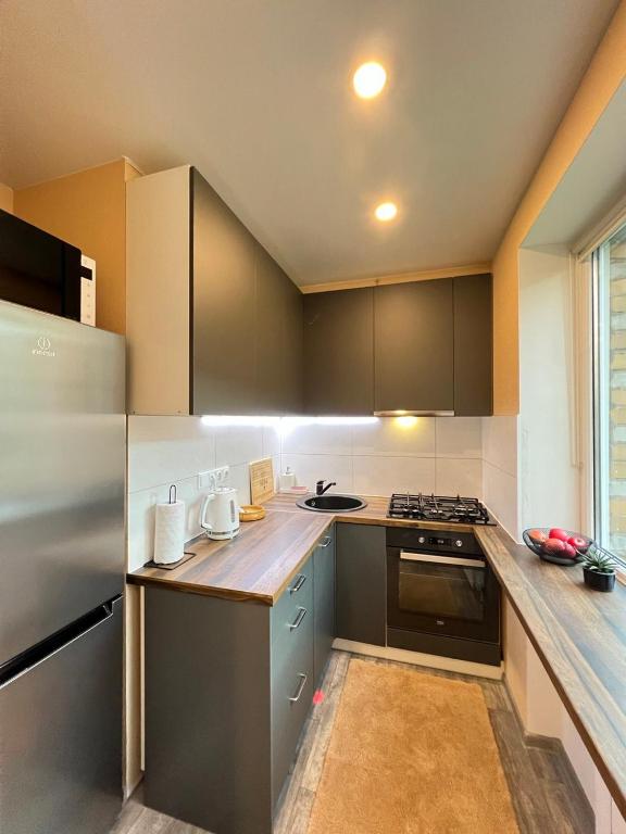 Kuchyň nebo kuchyňský kout v ubytování Top Location Apartment