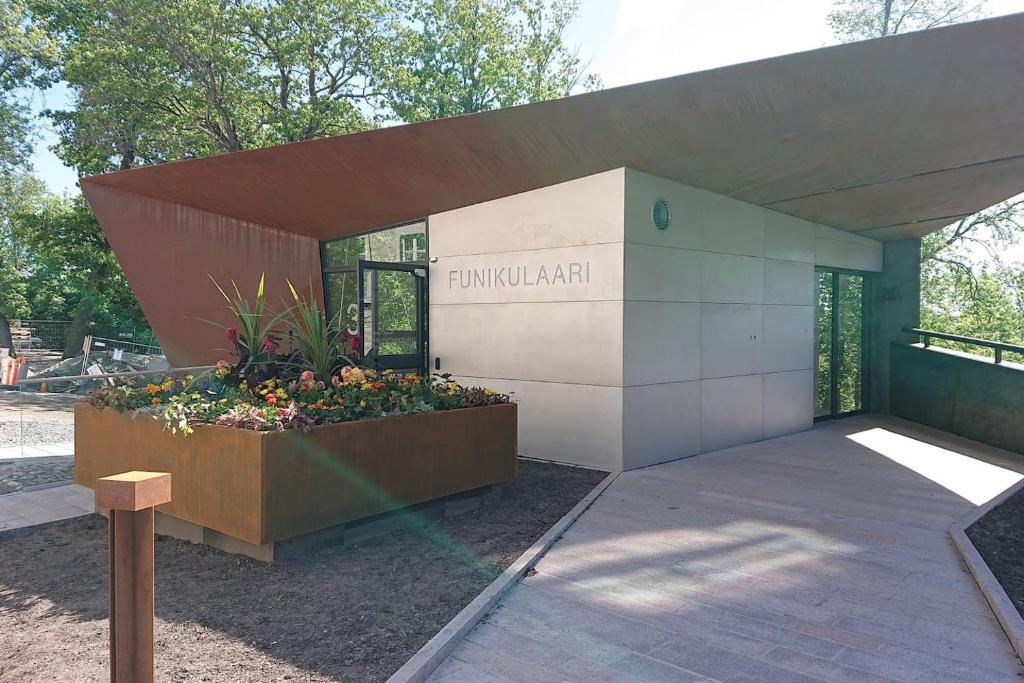 a building with a sign on the side of it at Studio Kakolanmäellä in Turku