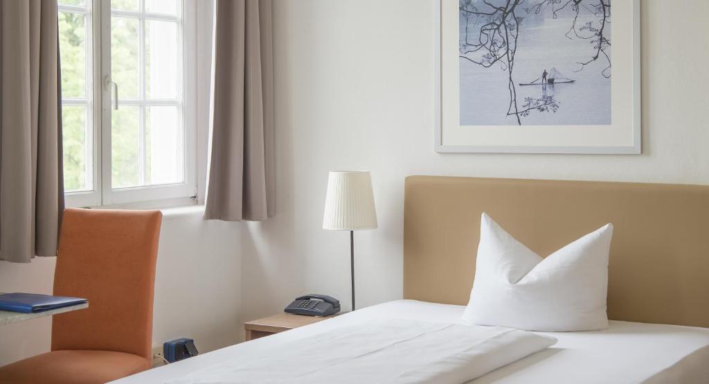 Postel nebo postele na pokoji v ubytování Apartment Hotel Konstanz