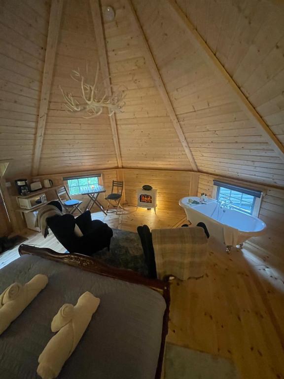 Postel nebo postele na pokoji v ubytování Aos Sí Lodges