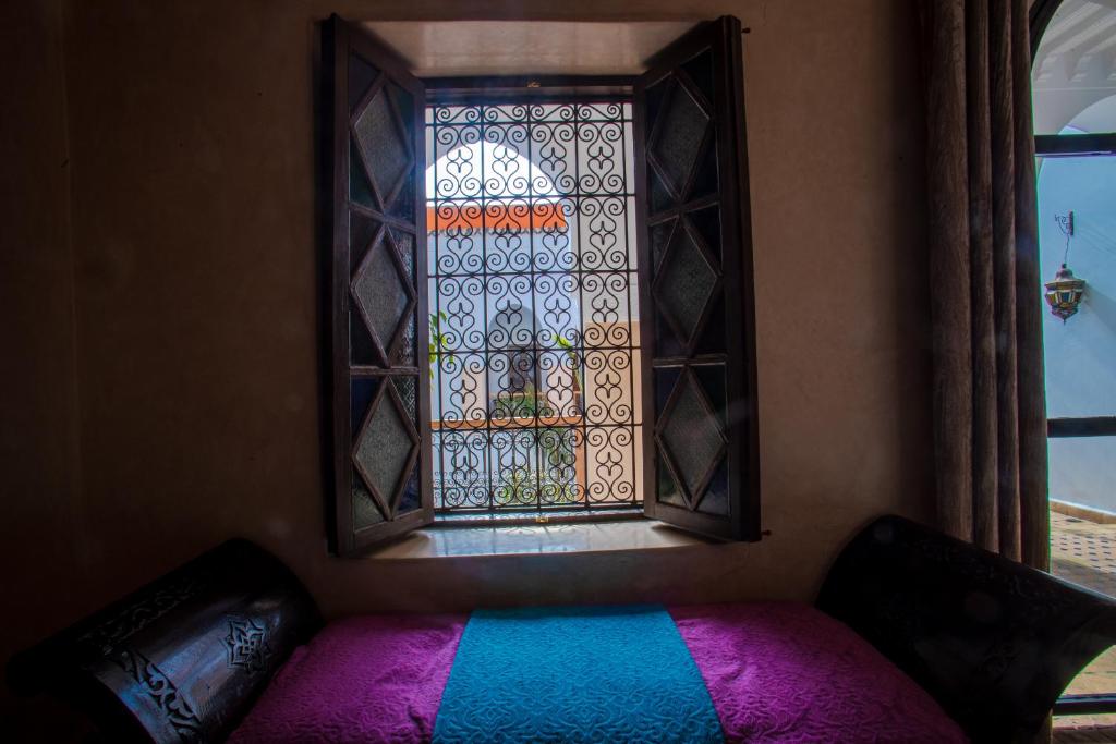 Postel nebo postele na pokoji v ubytování Riad Le Jardin de Lea, Suites & Spa