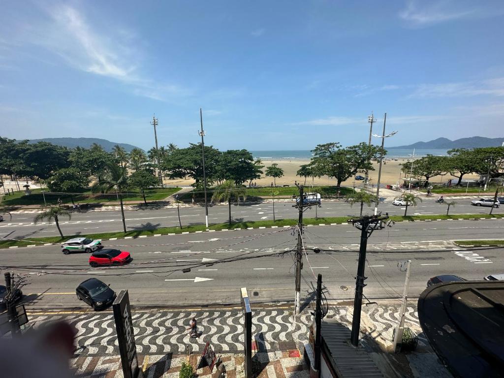 a view of a parking lot with cars in it at Vista ao mar no Gonzaga in Santos