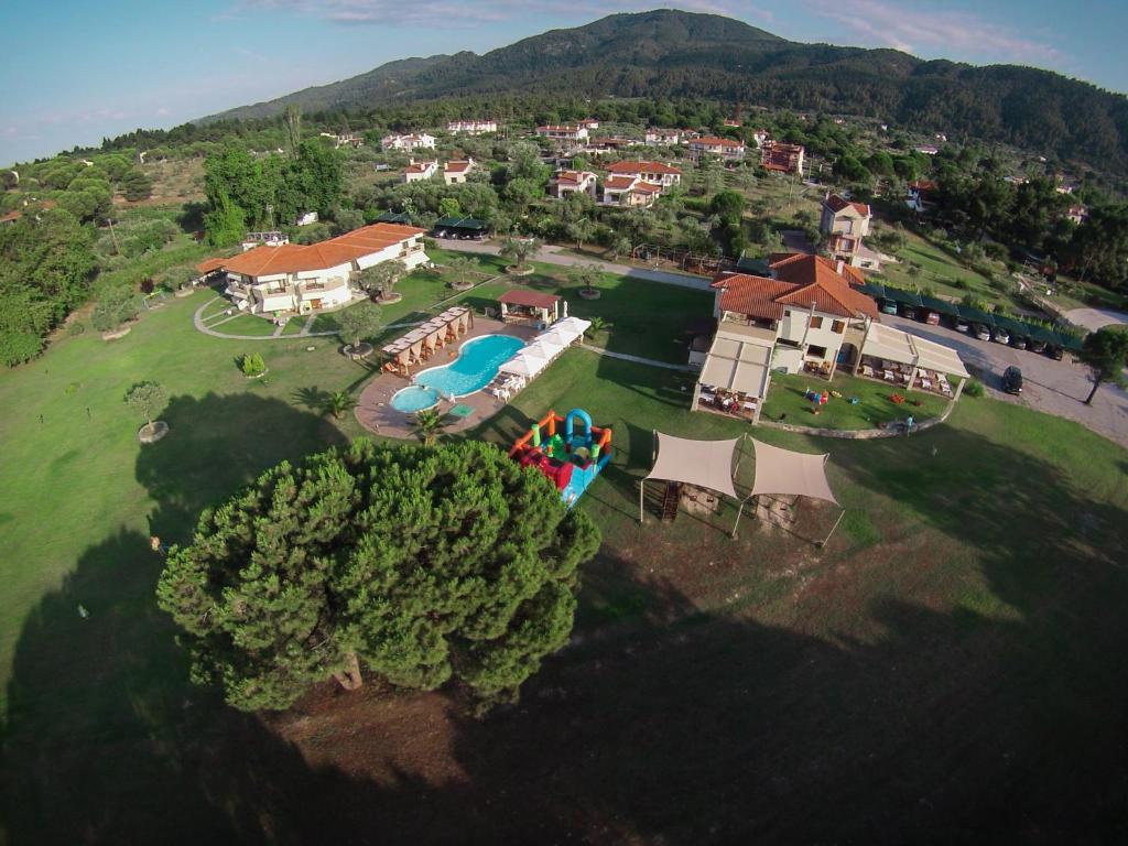 an aerial view of a house with a swimming pool at Top Studios in Vourvourou