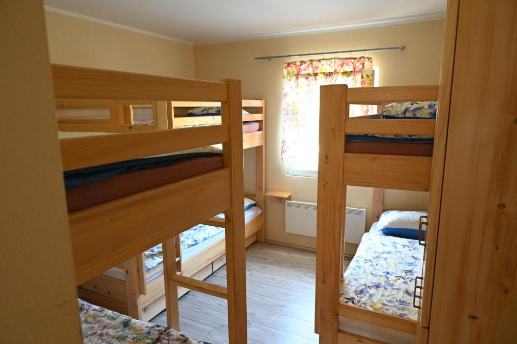 Postel nebo postele na pokoji v ubytování Domačija KOHOVO
