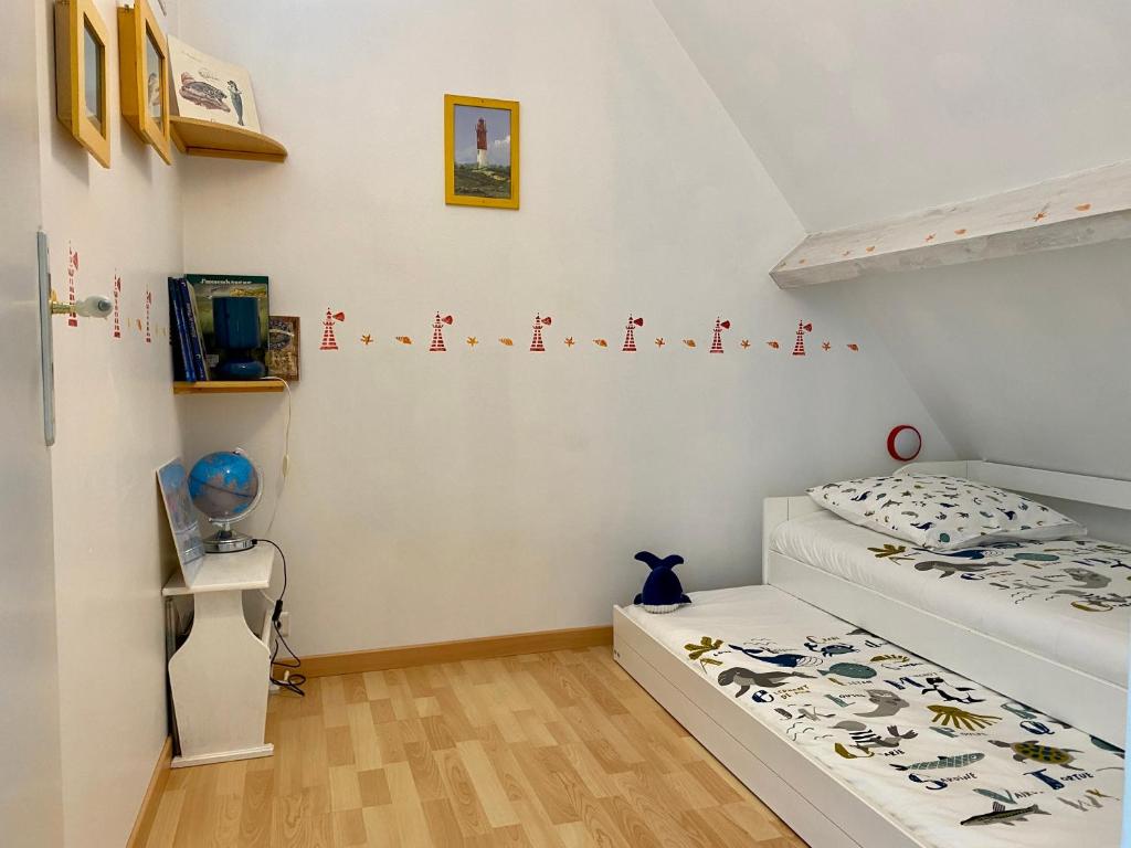 Postel nebo postele na pokoji v ubytování Le Gîte du Phare vue sur mer