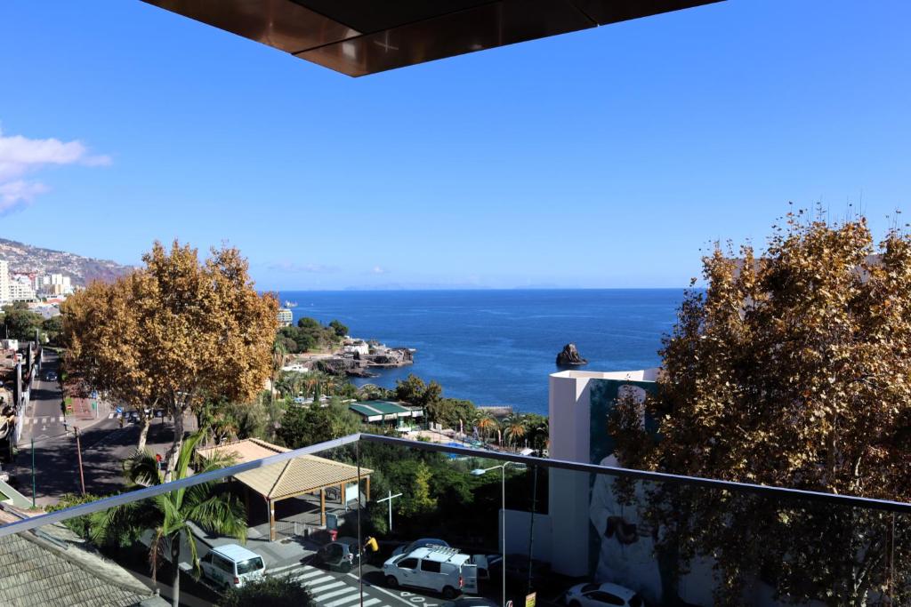 a view of the ocean from a building at Seaside XXI-10, By OP in Funchal