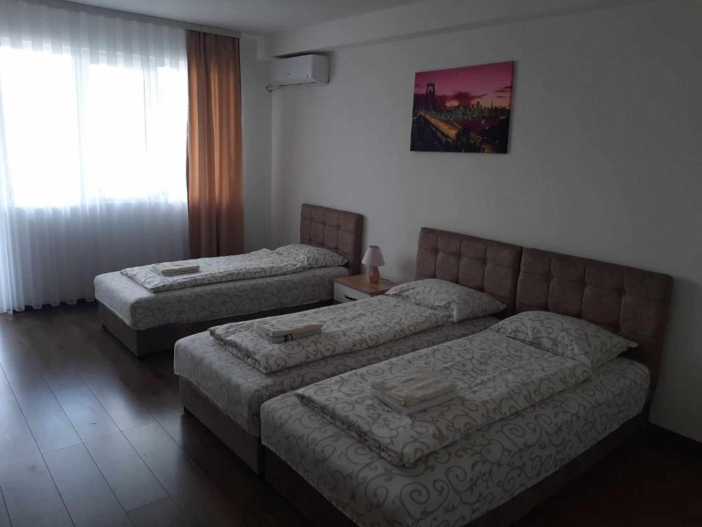 Postel nebo postele na pokoji v ubytování Apartmani Centar