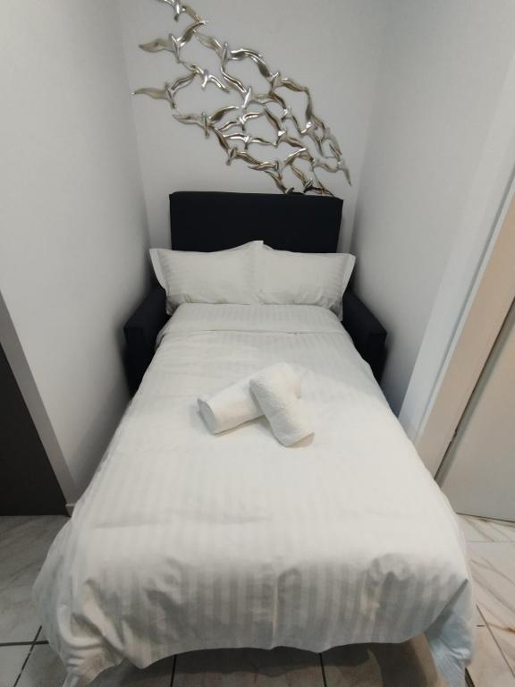 Postel nebo postele na pokoji v ubytování Kentrikon Guest House