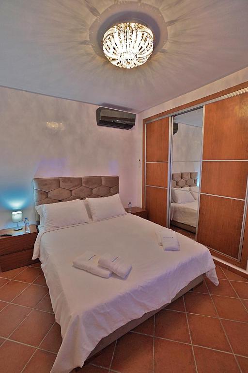 Postel nebo postele na pokoji v ubytování InHome Apartment