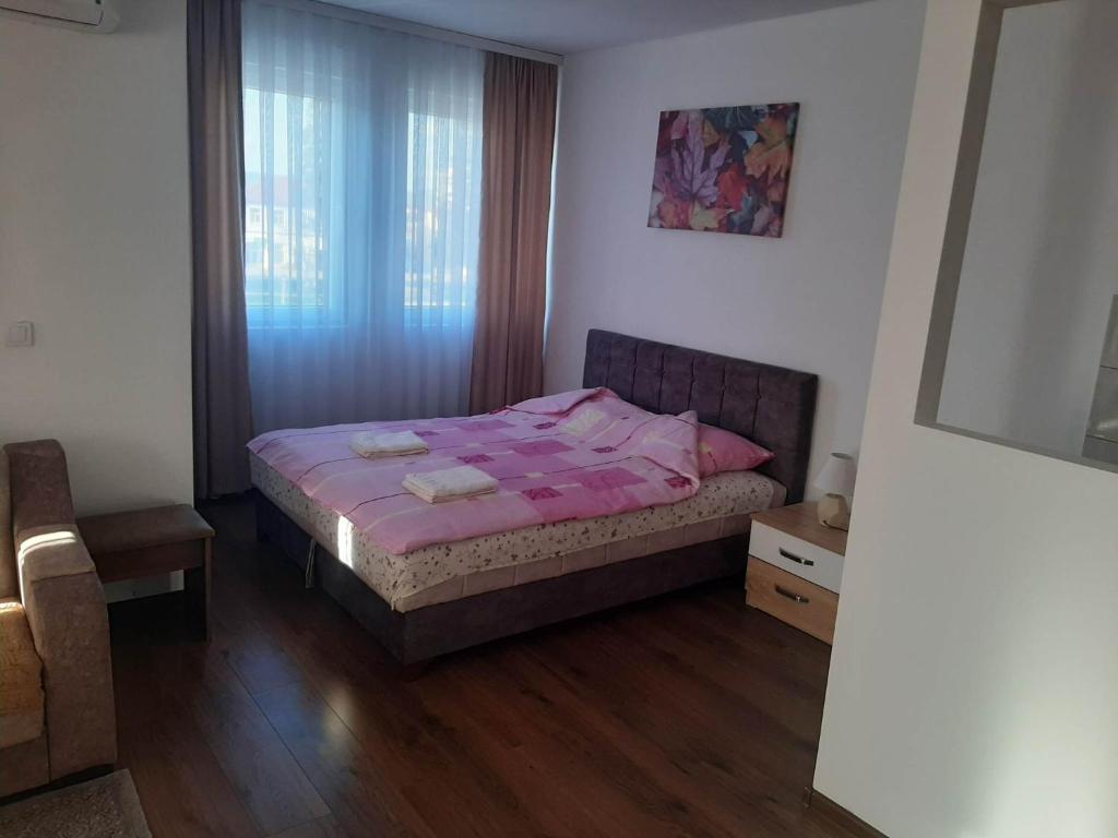 Postel nebo postele na pokoji v ubytování Apartmani Centar