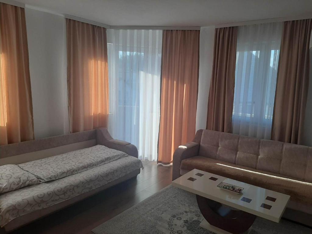 Postel nebo postele na pokoji v ubytování Apartmani Centar