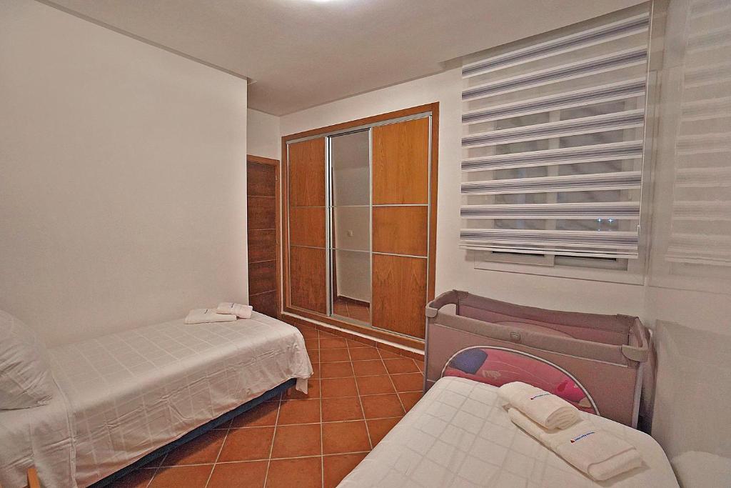 Postel nebo postele na pokoji v ubytování InHome Apartment