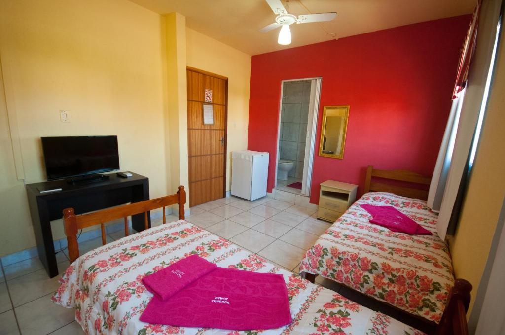 Postel nebo postele na pokoji v ubytování Pousada Jomar