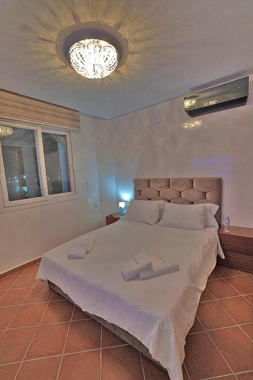 Postel nebo postele na pokoji v ubytování InHome Apartment