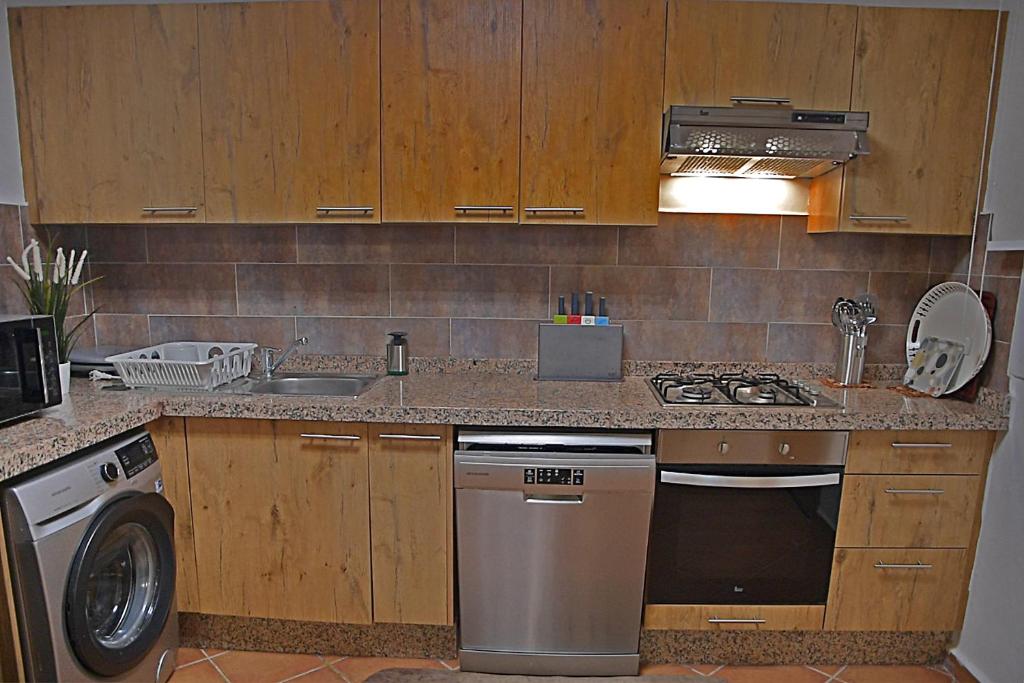 Kuchyň nebo kuchyňský kout v ubytování InHome Apartment