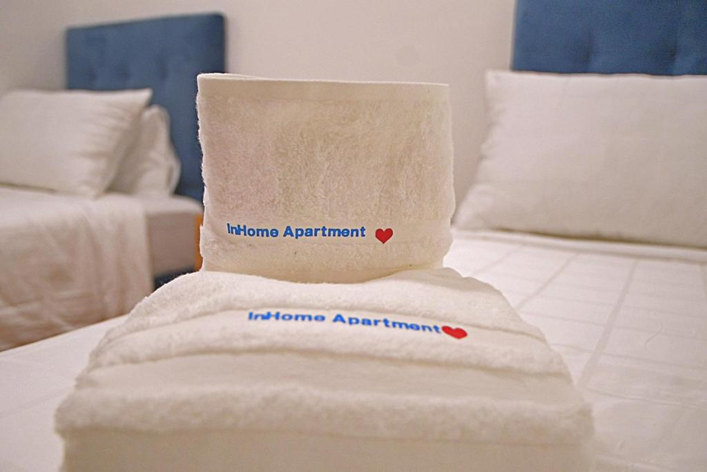 Postel nebo postele na pokoji v ubytování InHome Apartment