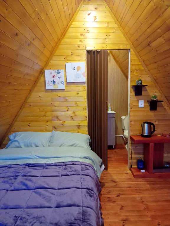 Postel nebo postele na pokoji v ubytování Cabañas el Olimpo