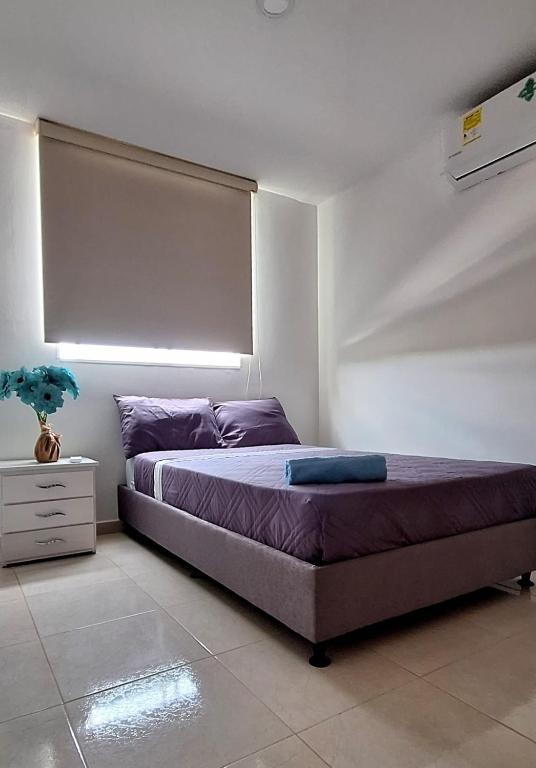 Postel nebo postele na pokoji v ubytování CB Somos AT HOME Apto cómodo e impecable con Aire Acondicionado