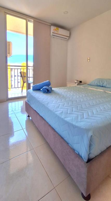 Postel nebo postele na pokoji v ubytování CB Somos AT HOME Apto cómodo e impecable con Aire Acondicionado