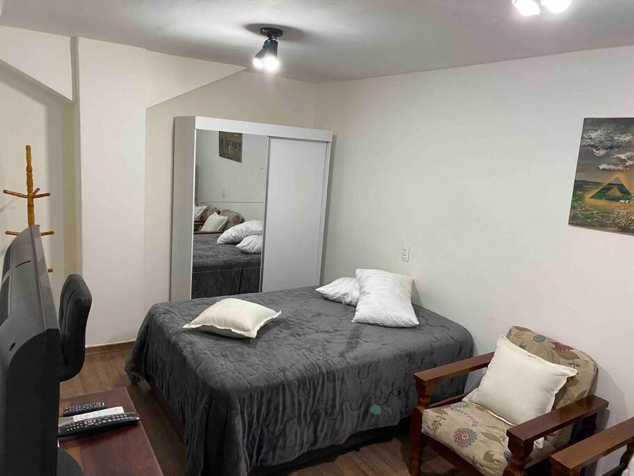 Ένα ή περισσότερα κρεβάτια σε δωμάτιο στο Apartamento Cinelândia/Lapa