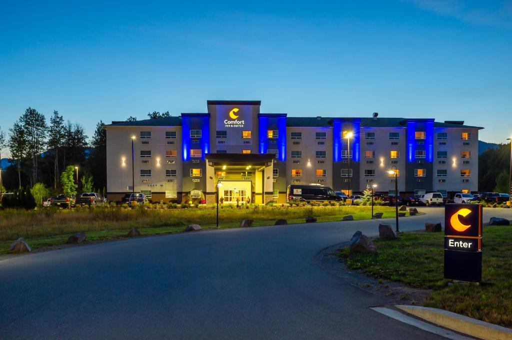 a building with blue lights on it at night at Comfort Inn & Suites in Terrace